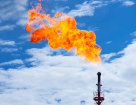 Torch against the sky. Incineration of associated gas in oil production